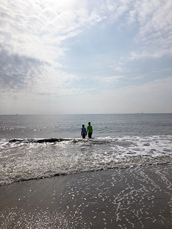 Kids in the ocean on the Tybee Island Beach.