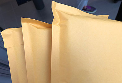 Three manila envelopes. 
