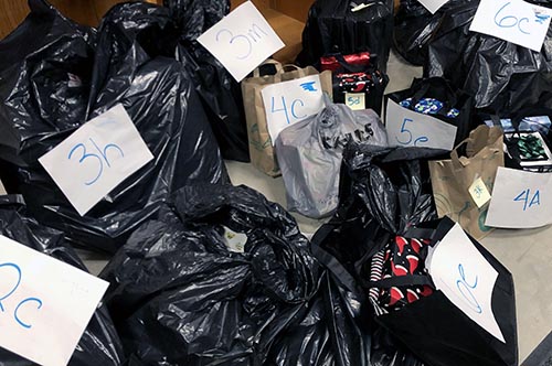 Black trash bags full of presents.